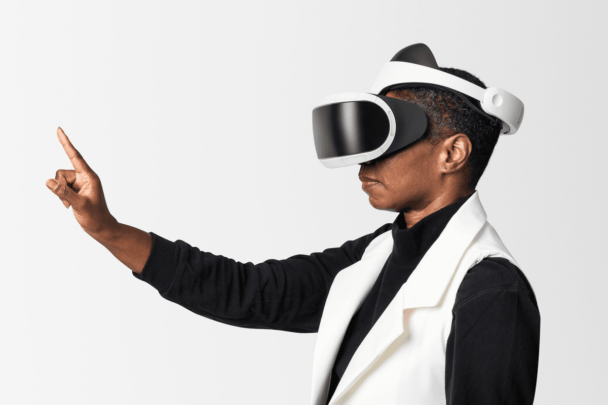 Person wearing VR headset pointing forward in futuristic setting