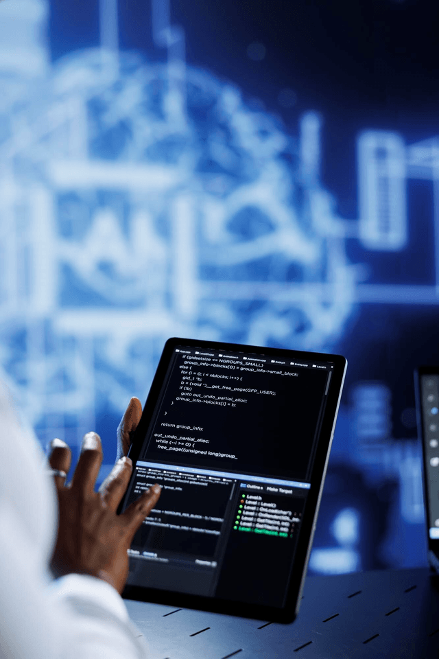 Developer working on code with multiple screens