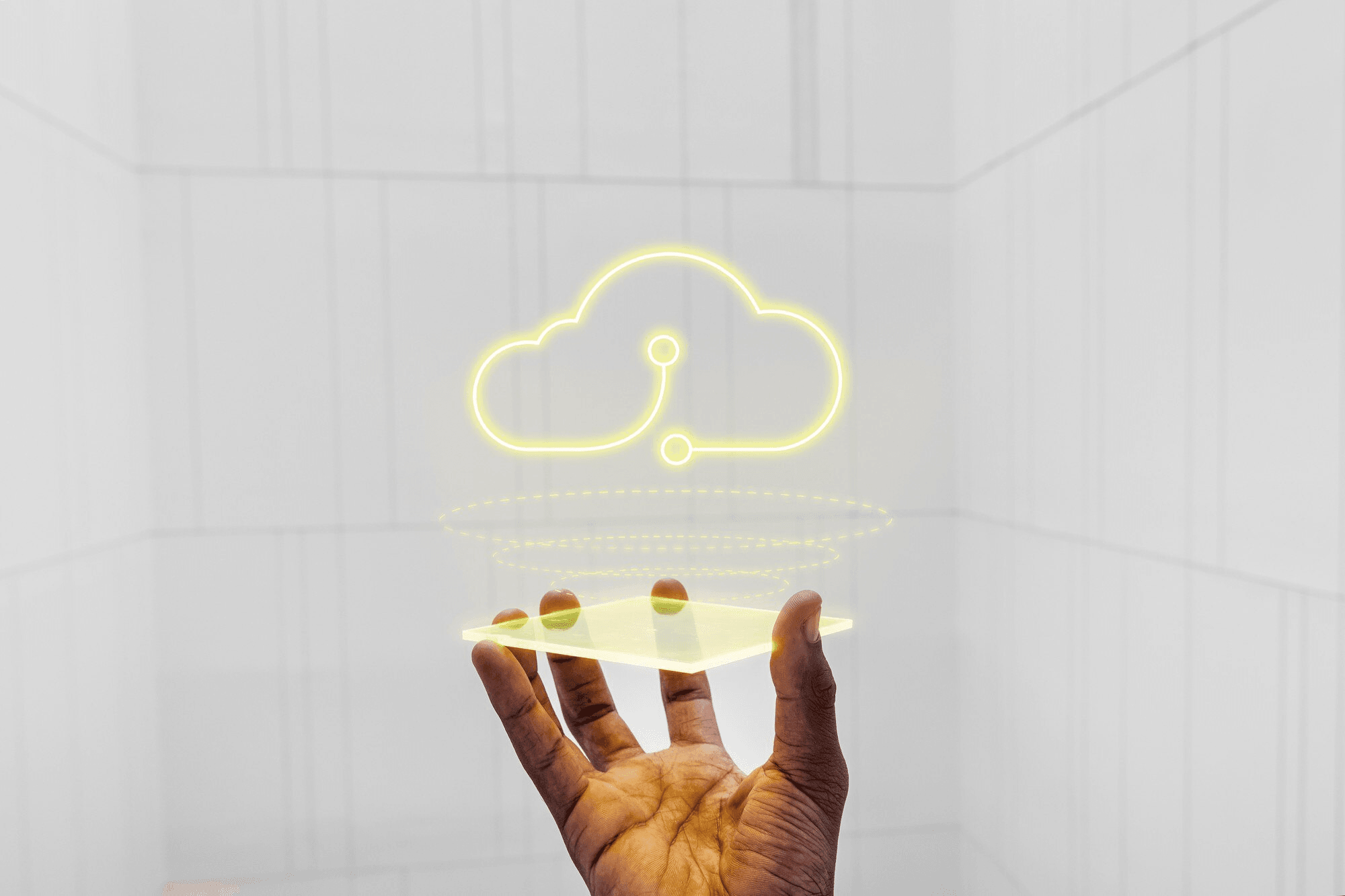 Hand reaching toward cloud technology icon representing IT solutions